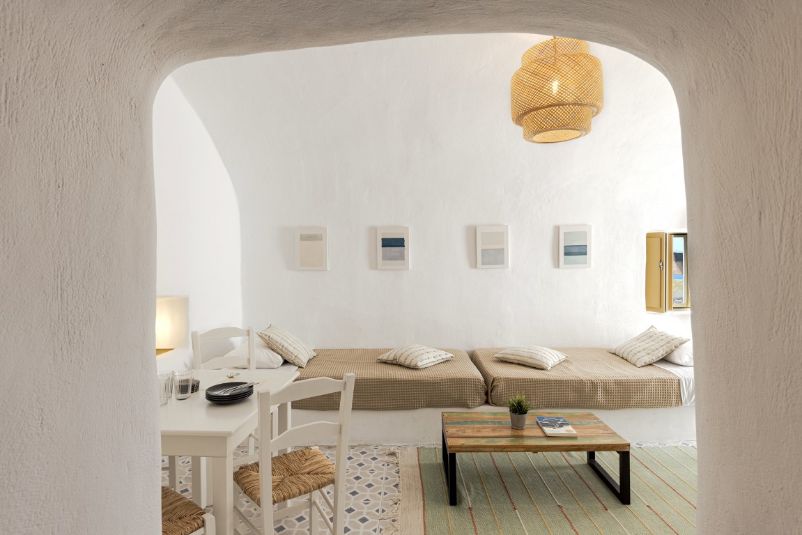 Outdoor seating at Cave Studio balcony in Oia Santorini