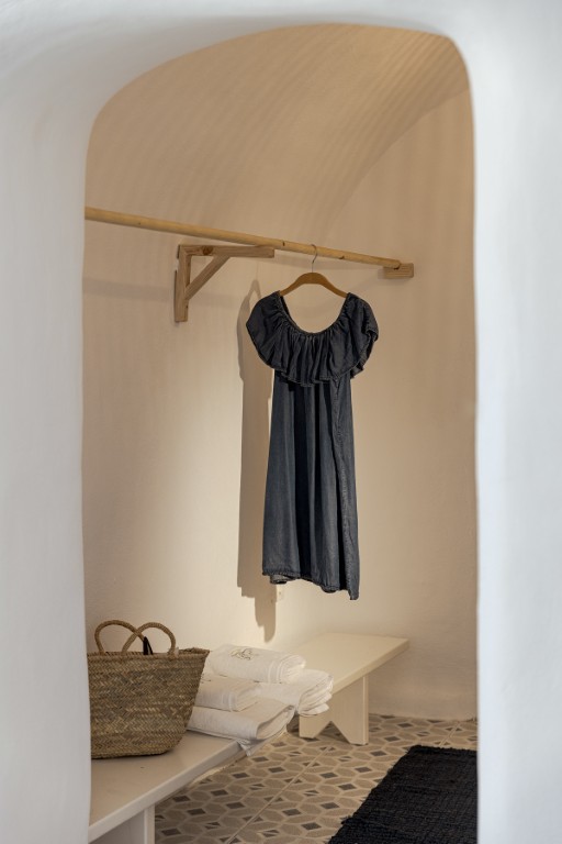 Cave Studio with Balcony bedroom with cave-style arches in Oia