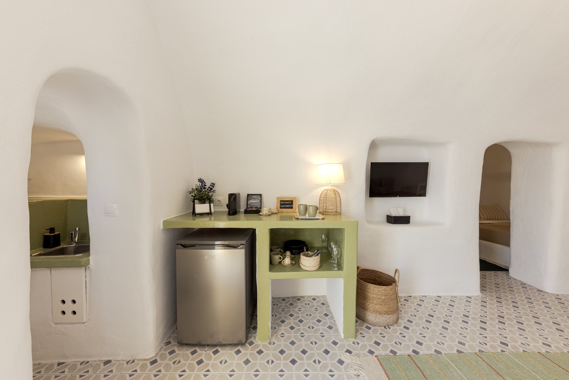 Outdoor seating at Cave Studio balcony in Oia Santorini