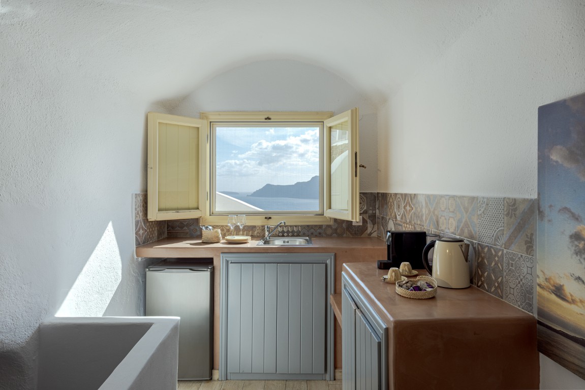 Dining area and kitchenette inside Earth Cave House