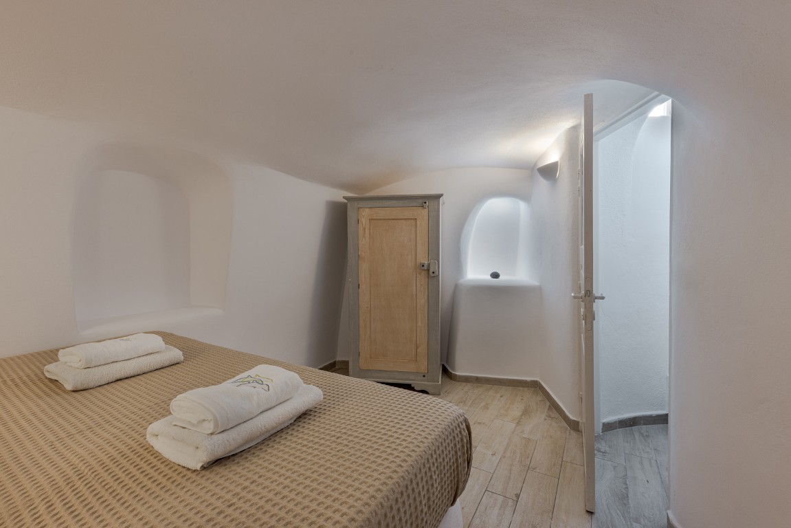 Dining area and kitchenette inside Earth Cave House