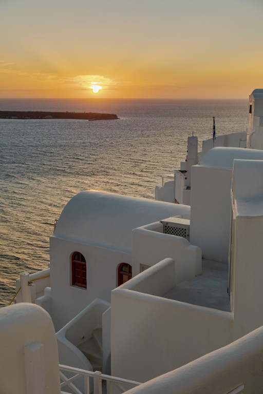 Sunset view from Earth Cave House terrace in Oia