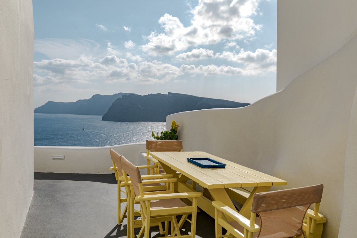 Sunset view from Earth Cave House terrace in Oia