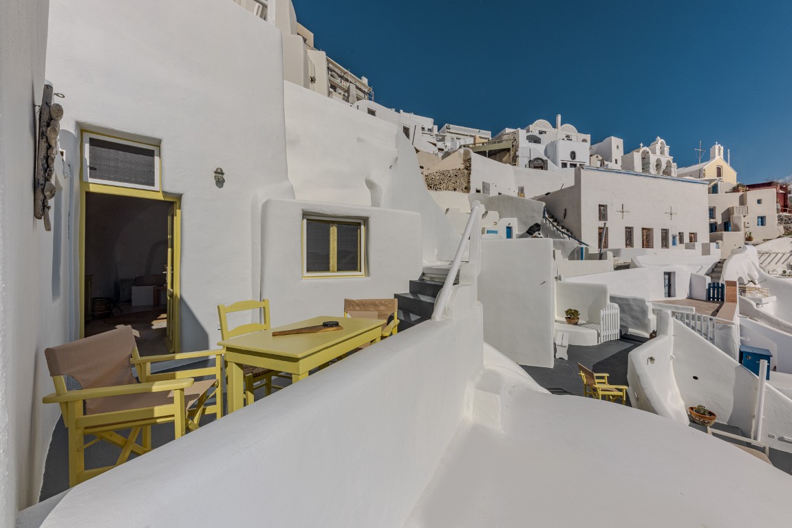 Romantic terrace seating at Wind House in Oia