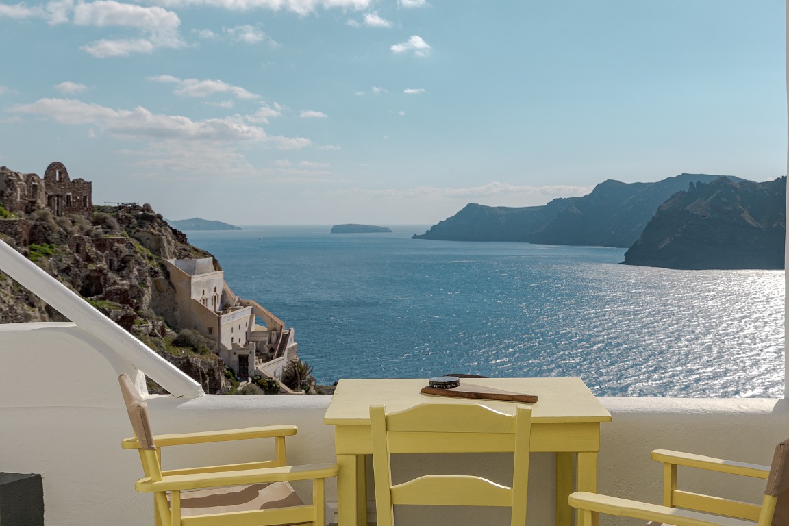 Romantic terrace seating at Wind House in Oia